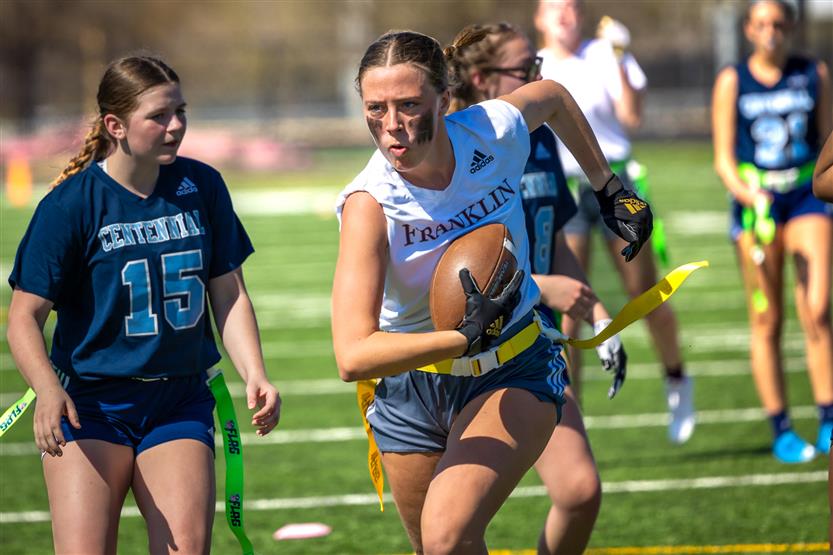 Students play flag football